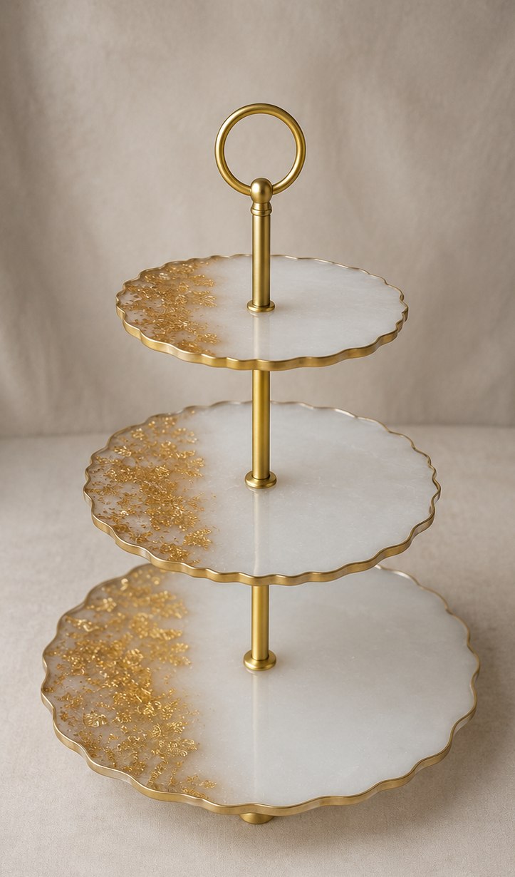 Handcrafted ivory resin three-tier dessert stand with gold leaf detail and scalloped edges