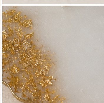 Studio photo — gold leaf detail in ivory resin