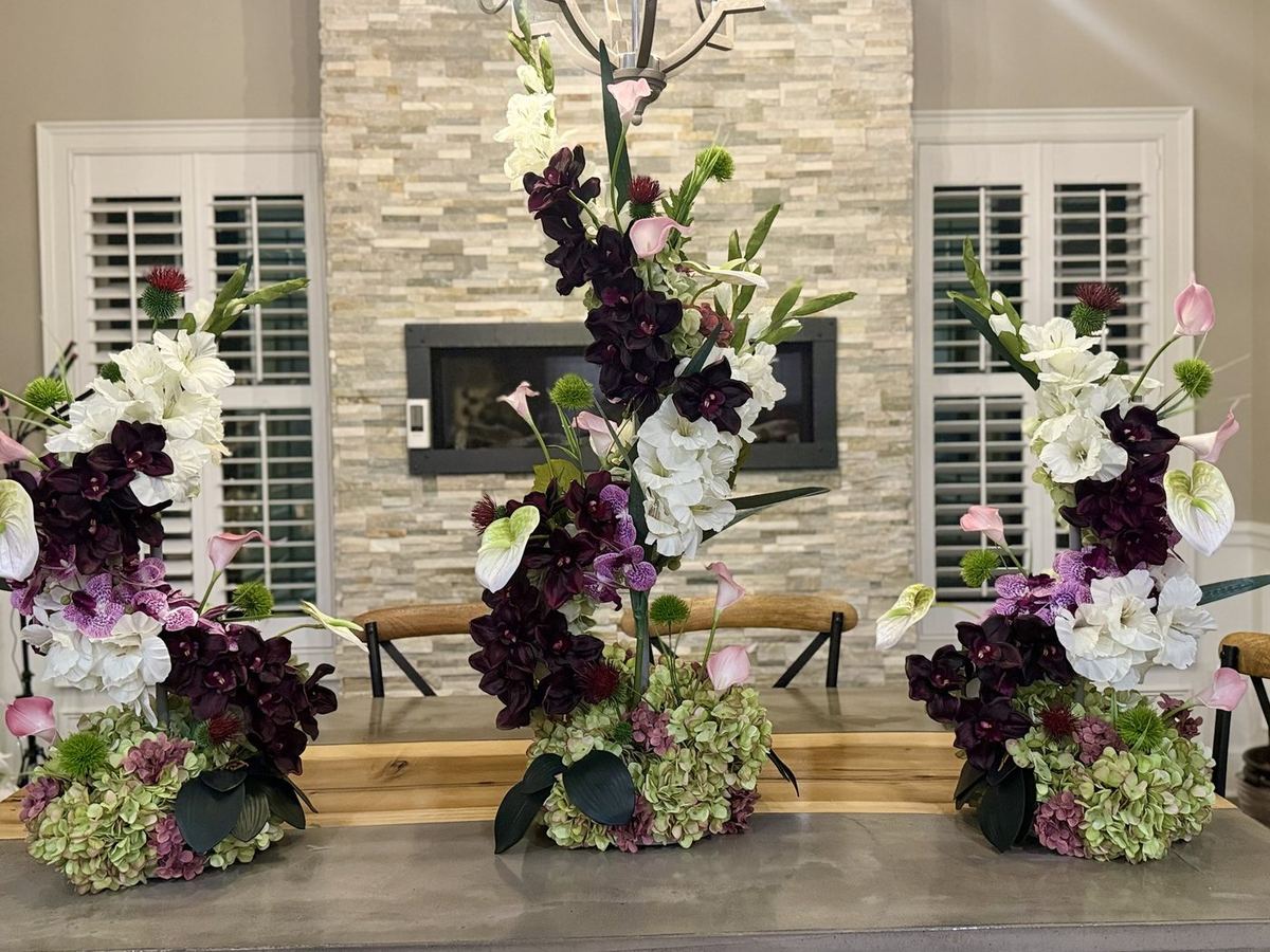 Layered floral installation in purple and white