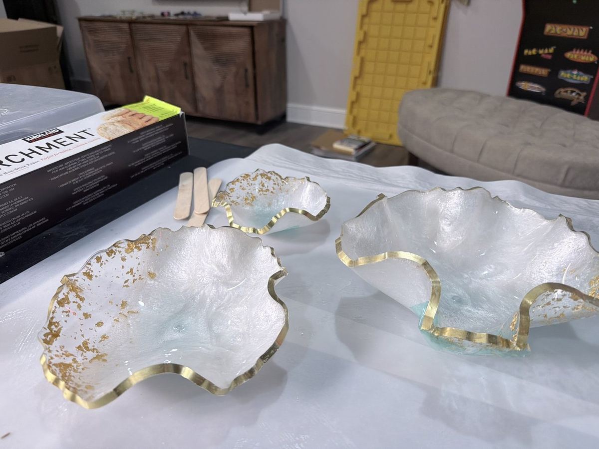 Sculpted resin serving bowls with gold edges