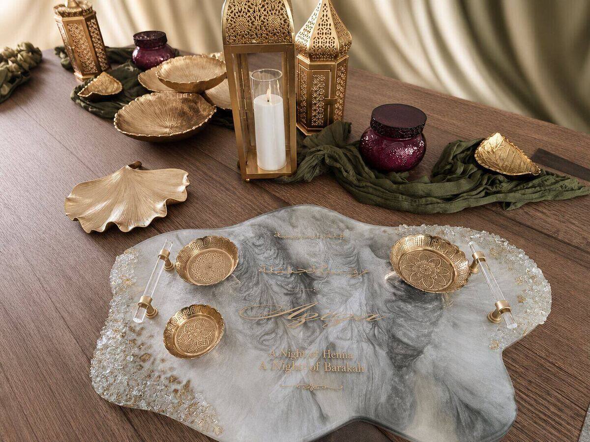 Henna night tablescape with gold lanterns, gilded dishes and a custom resin tray