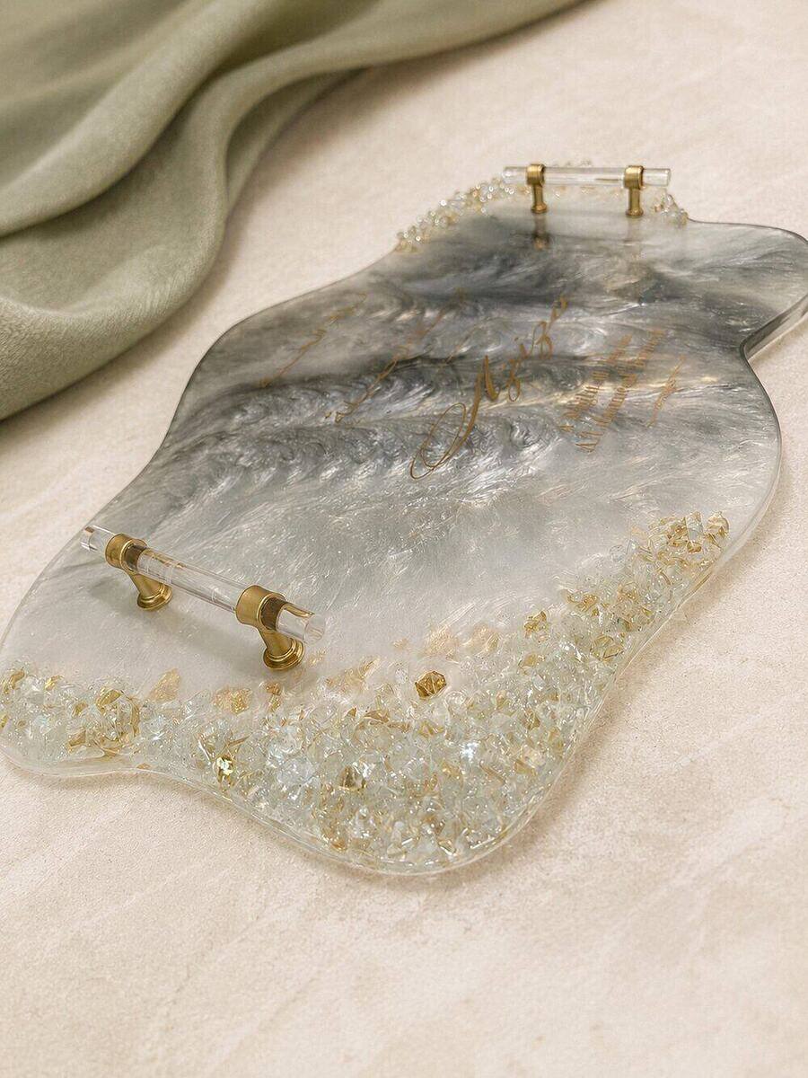 Clear and grey resin serving tray with crushed crystal edge, gold leaf and acrylic handles