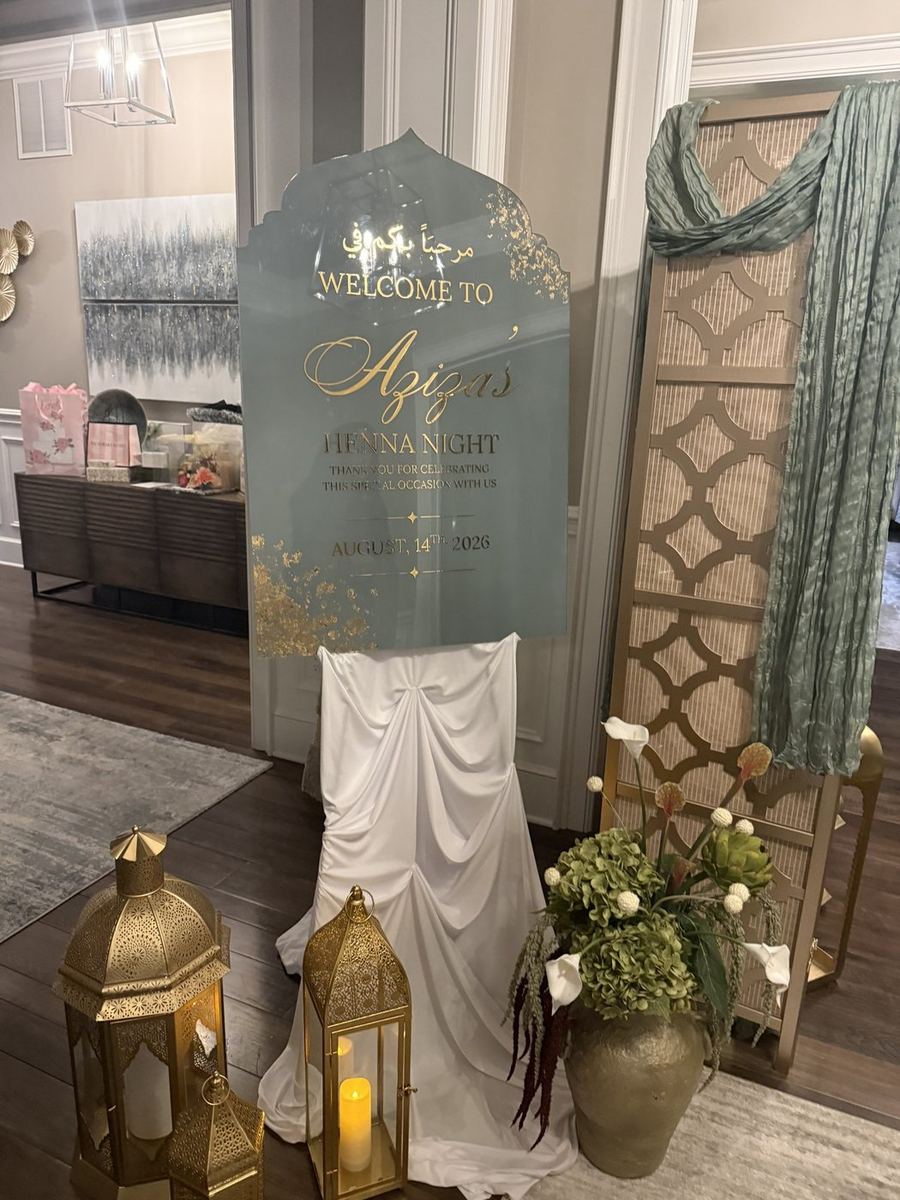 Arched acrylic welcome sign in gold lettering